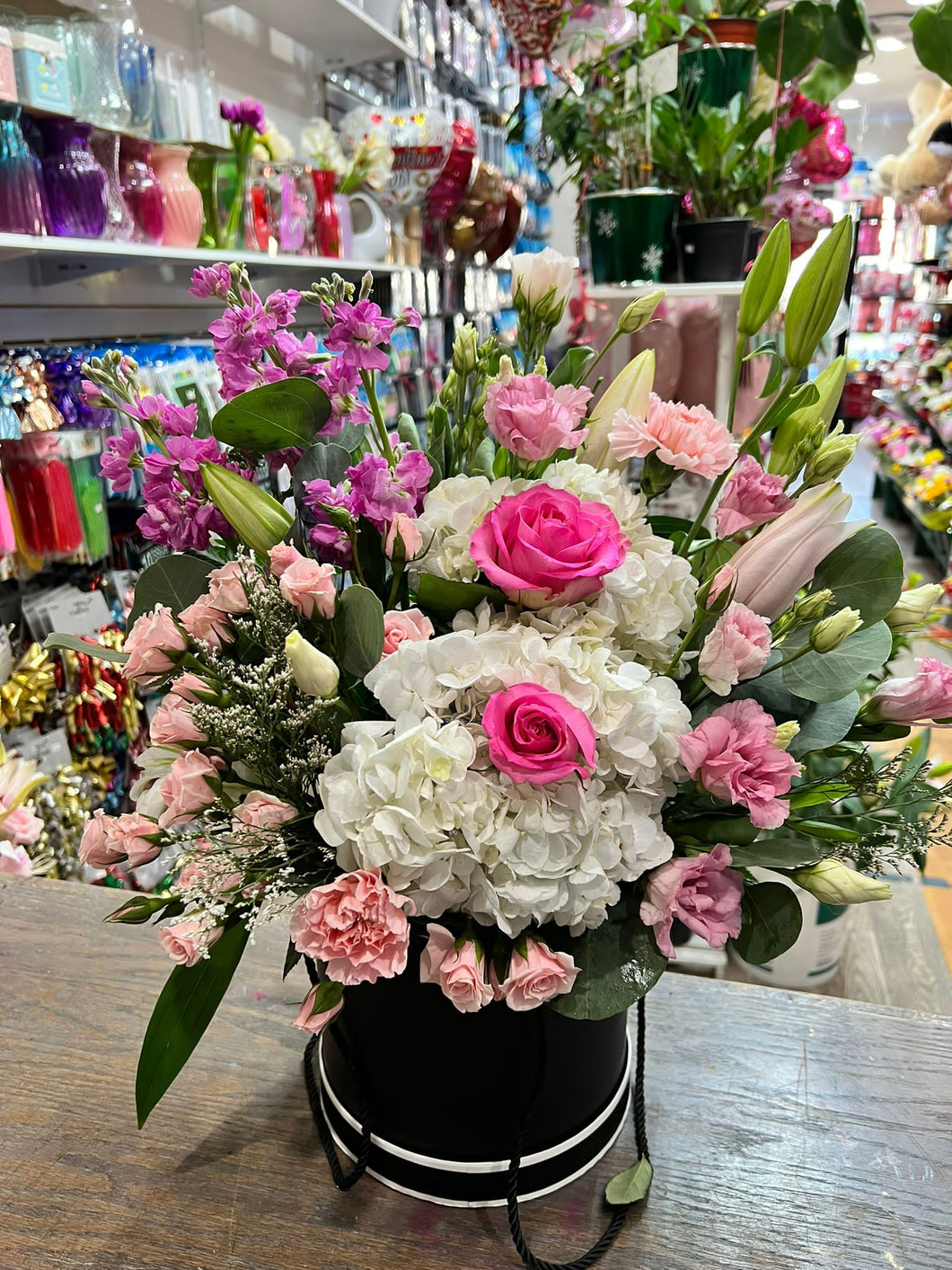 Pink arrangement in box