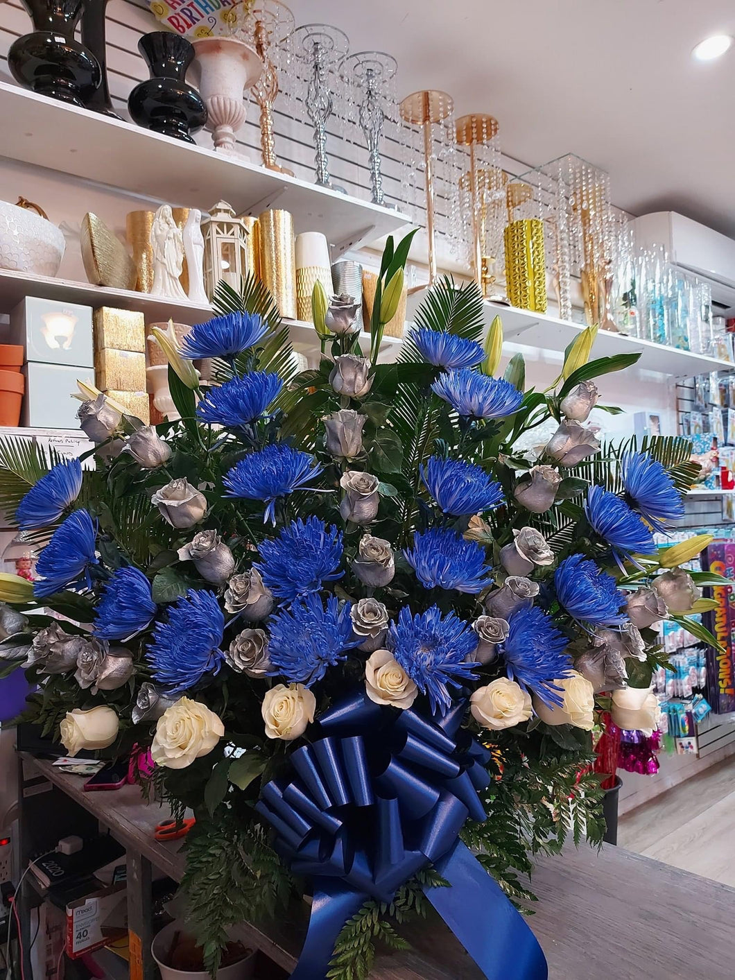 Silver roses with blue spider