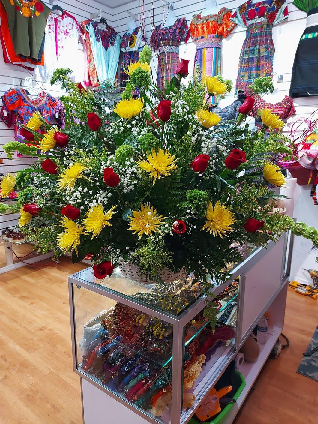 yellow arrangement with red roses